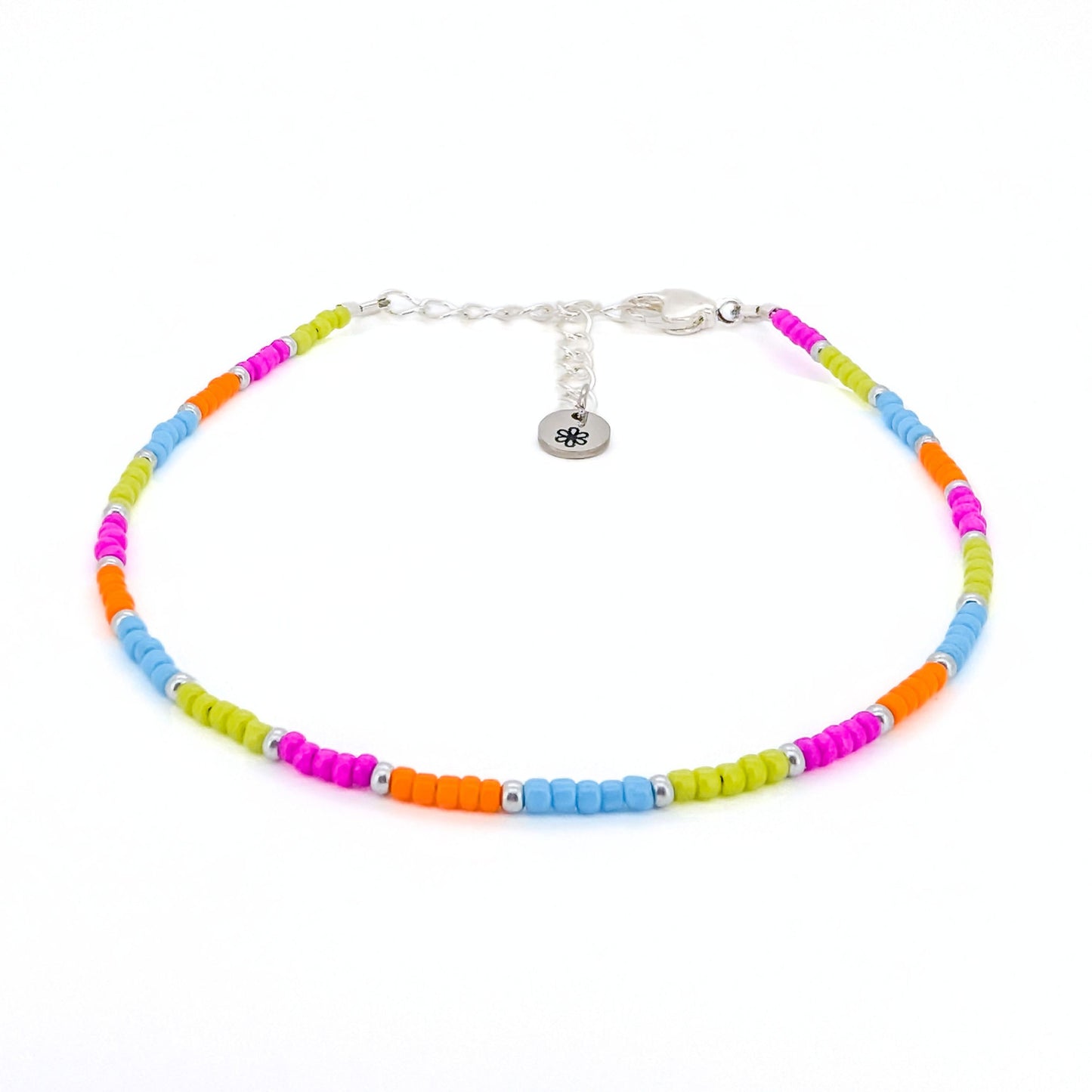 Colorful beaded bracelet with a silver clasp on a white background