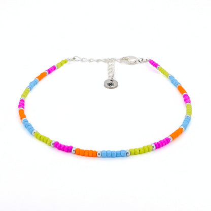 Colorful beaded bracelet with a silver clasp on a white background