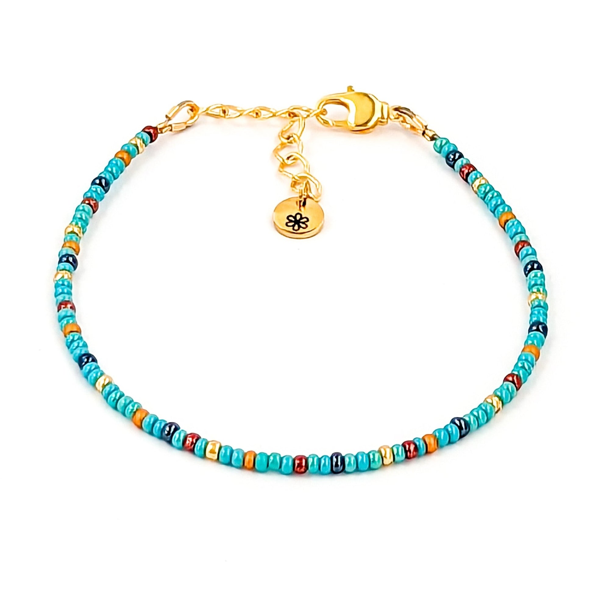 Dainty bracelet - turquoise, gunmetal, gold and copper glass seed beads - creations by cherie